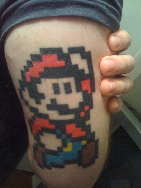 tattoos on back of arm. Mario on back of arm. An awesome mario tattoo on someones arm