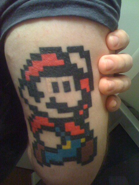 Mario on back of arm. An awesome mario tattoo Mario on back of arm. An awesome mario tattoo