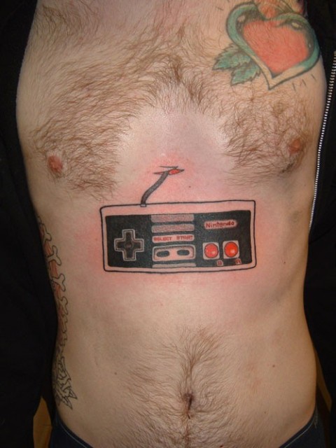 games ever, but this geeky guitar hero controller tattoo takes being a